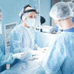 Surgical Team. Professional Smart Medical Assistant Wearing Unif