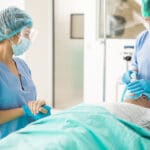 Holding Hand Of A Patient Before Surgery