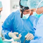 Hospital – surgery team in the operating room or Op of a clinic