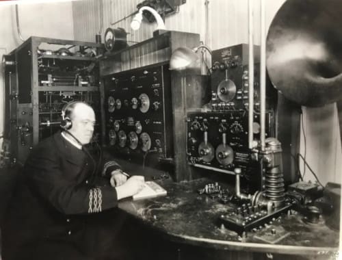 Elmo Pickerill using early radio equipment.