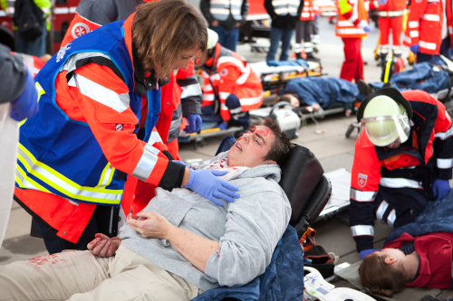 A group of nurses and paramedics participating in an emergency management training