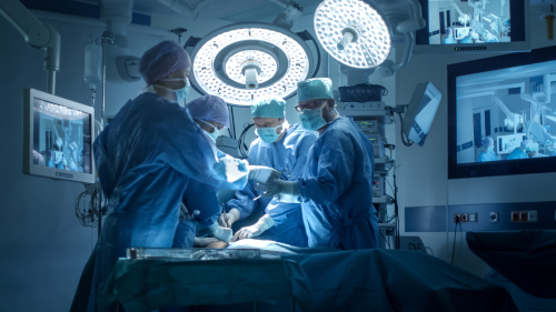 A surgical team doing a surgery in an operating room