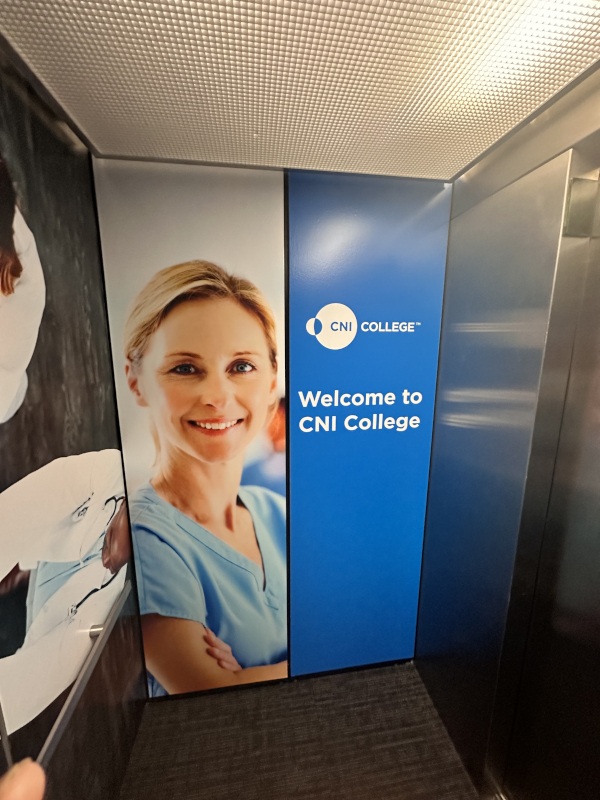 A poster in the new expansion of CNI College that says Welcome to CNI College